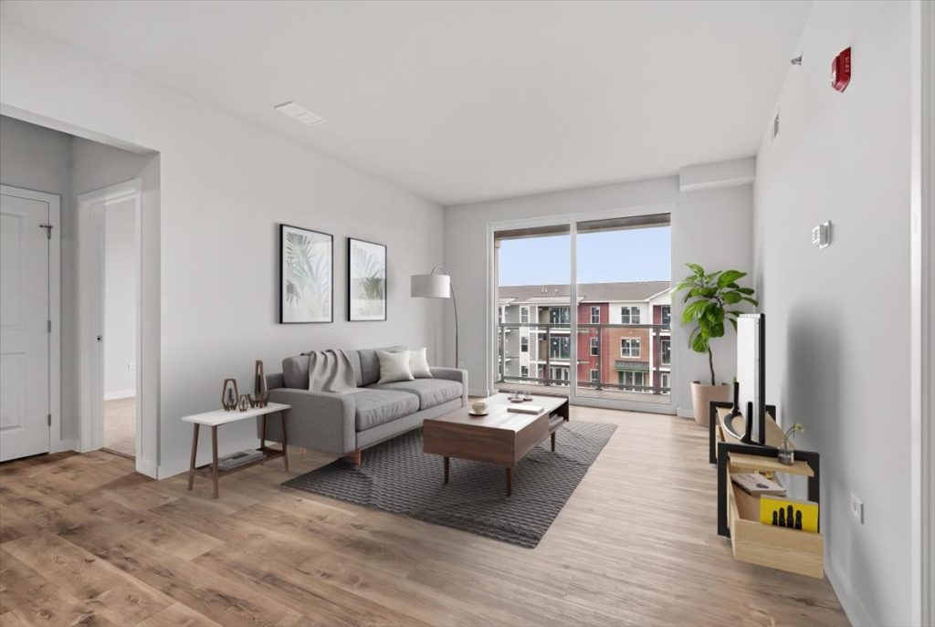 Virtually staged living room at Randall Terrace with large windows and balcony